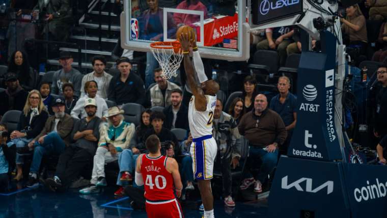 Two-handed dunk at the rim during an NBA game in Las Vegas, Las Vegas sports photography
