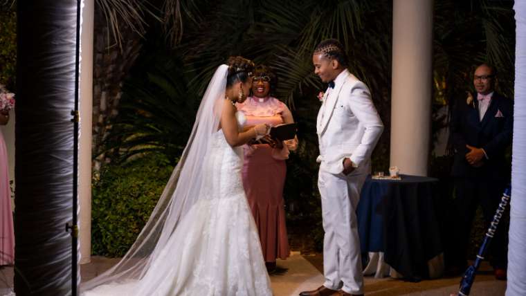 Bride and groom at the garden altar during their ceremony, Las Vegas wedding photography